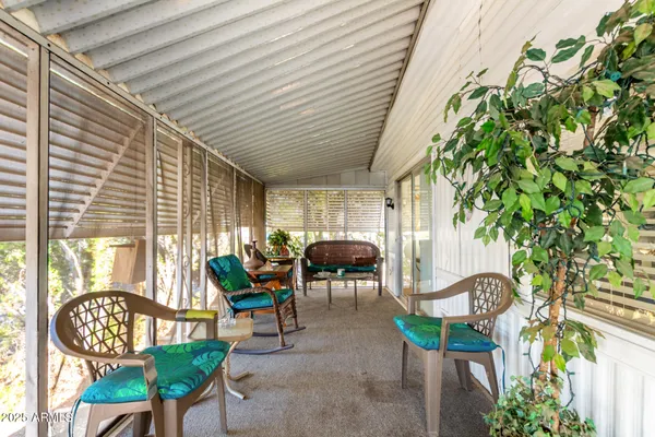 an outdoor living with furniture