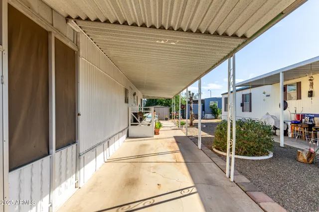 a view of a backyard with sitting area