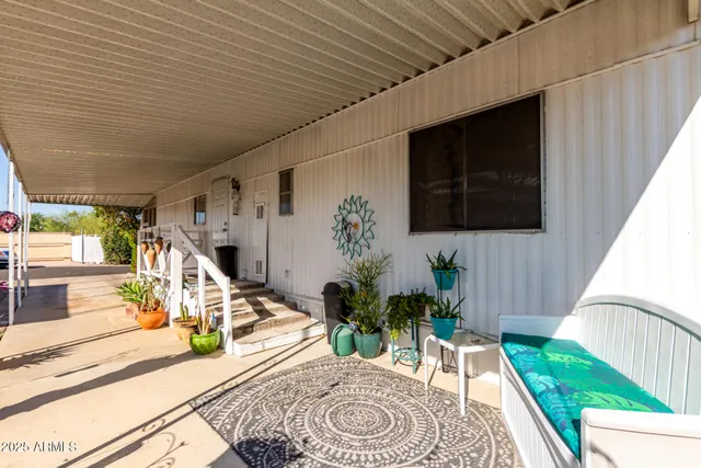 a view of a porch with furniture