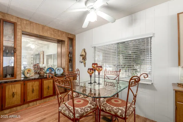 a view of a dining room with furniture and wooden floor