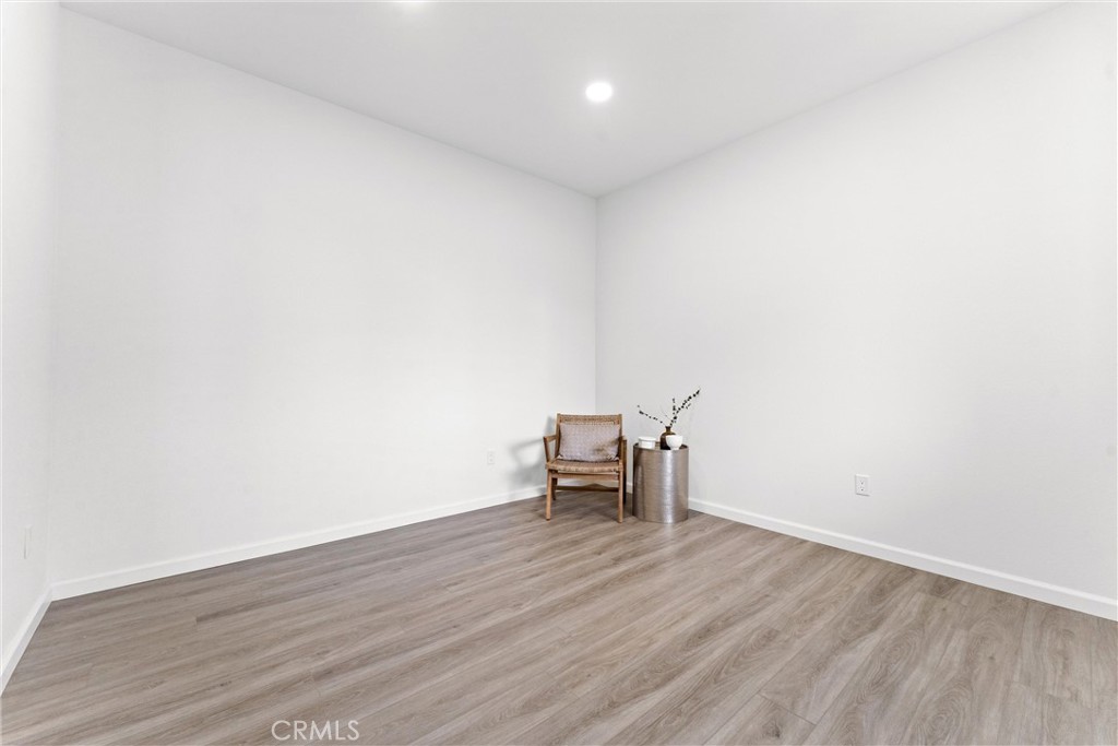 1993 Lyon Avenue Riverside, CA 92503 - Photo 18 of 61 a view of an empty room and wooden floor