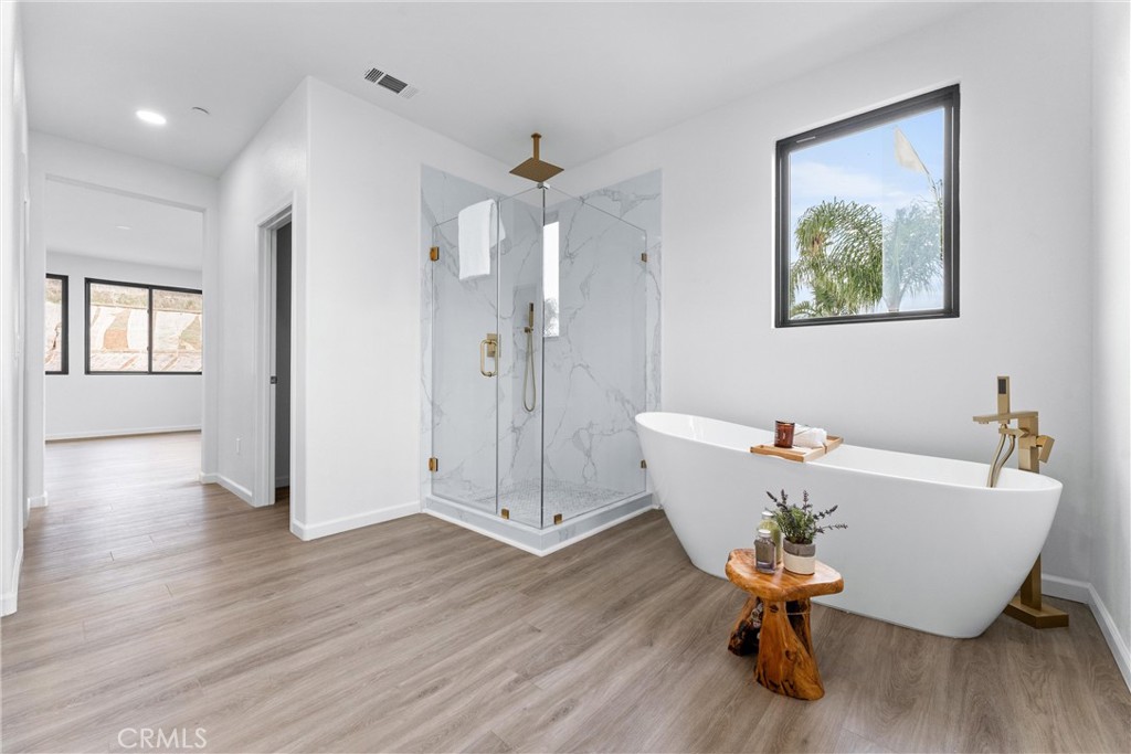 1993 Lyon Avenue Riverside, CA 92503 - Photo 37 of 61 a living room with a dining table and wooden floor