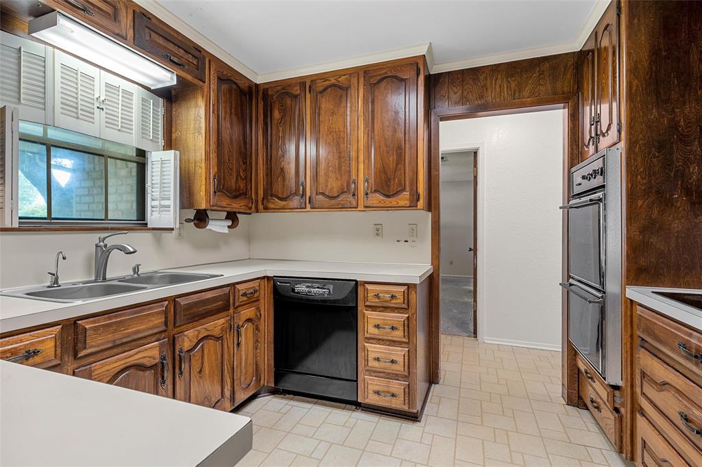219 Opal Street Hewitt, TX 76643 - Photo 9 of 28 a kitchen with stainless steel appliances granite countertop a refrigerator and a sink