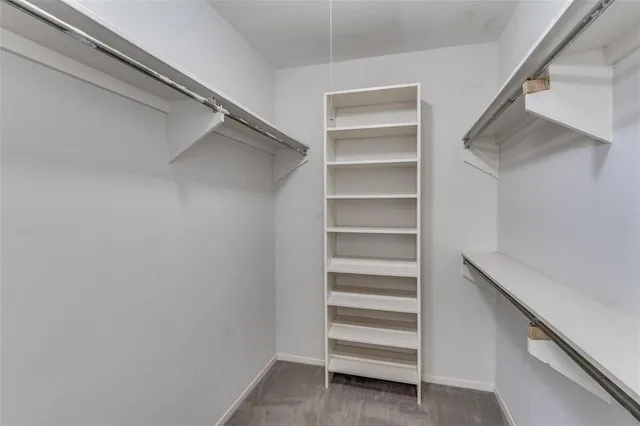 a bathroom with double sink and a mirror