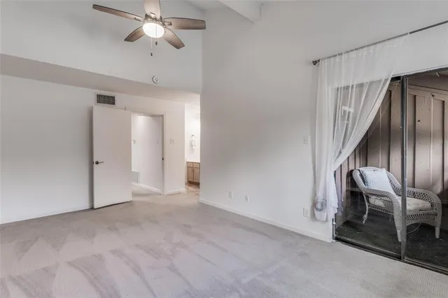 a balcony with furniture and a window
