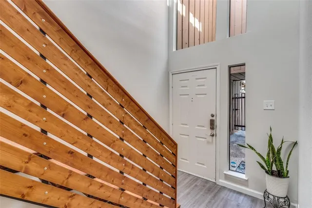 a view of entryway with wooden floor