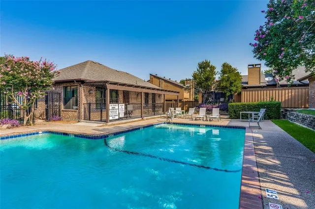 a view of a park with large trees