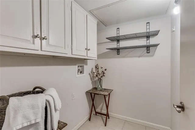 a view of a closet area with racks on the wall