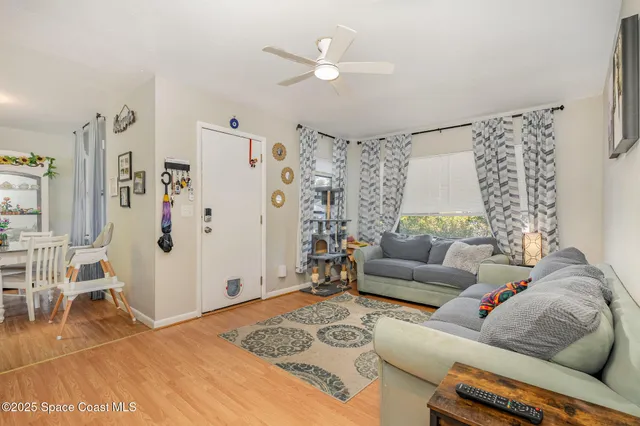 a living room with furniture and white walls