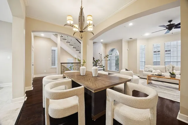 a very nice looking dining room with a table and chairs