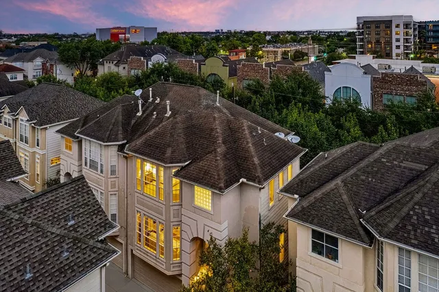 aerial view of a house with a yard