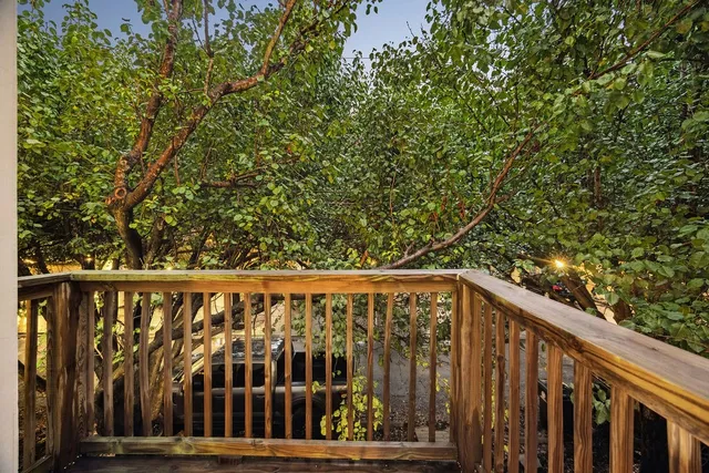 a view of wooden balcony with swing