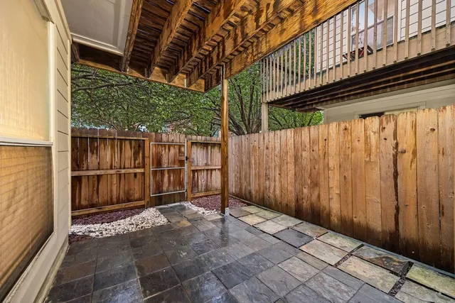 a view of small space with wooden fence