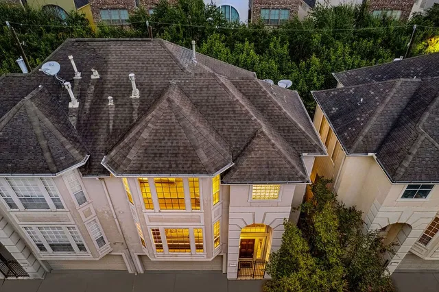 a aerial view of a house with a yard