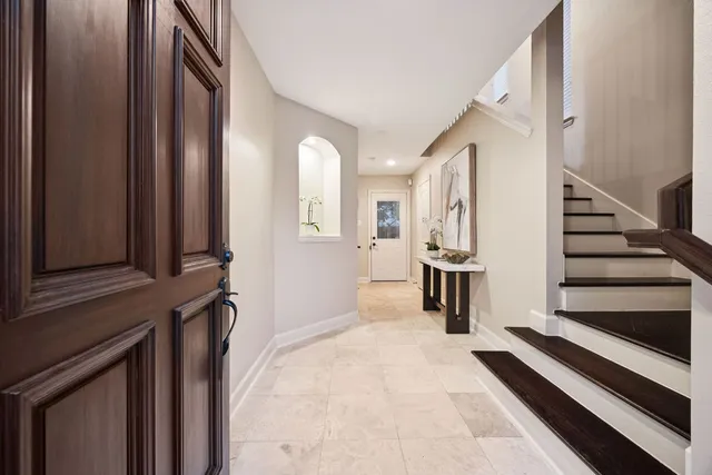 a view of a kitchen with furniture and staircase