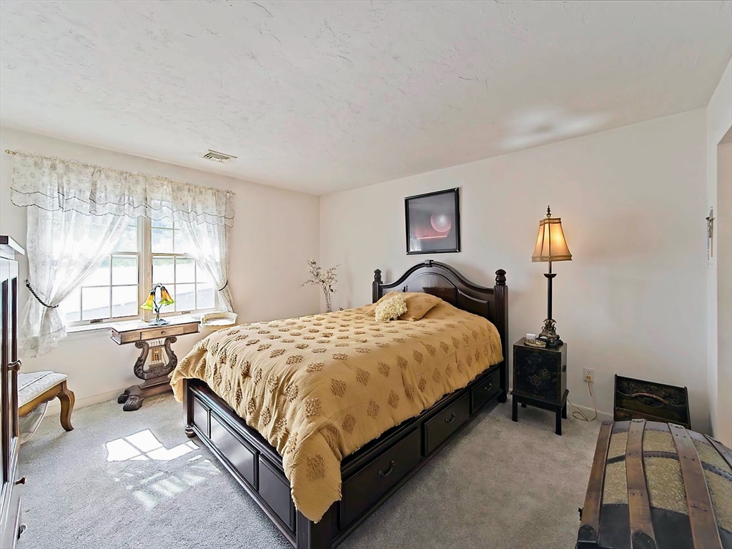 700 Shore Drive, Unit 1205 Fall River, MA 02721 - Photo 14 of 20 a spacious bedroom with a bed and a window