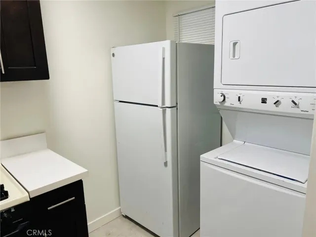 a white refrigerator freezer sitting inside of a kitchen