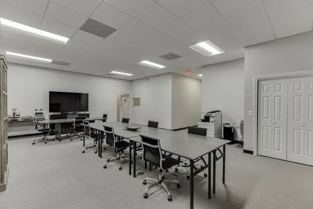 a view of a workspace with furniture