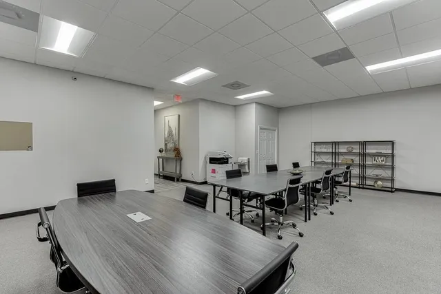 a view of a workspace with furniture