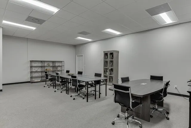 a view of a workspace with furniture