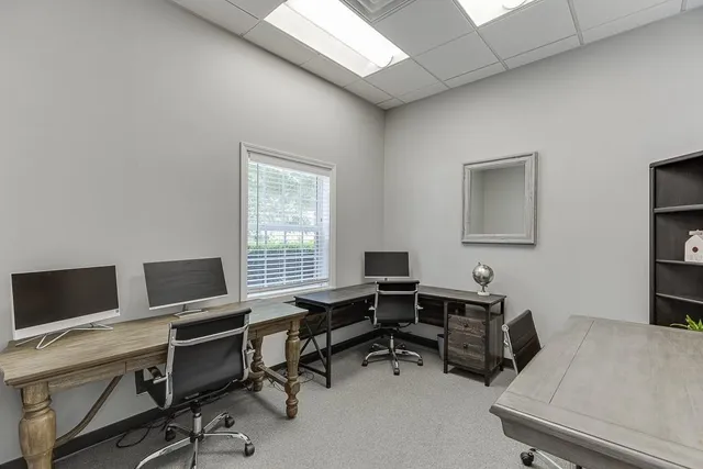 a bathroom with a sink toilet and mirror