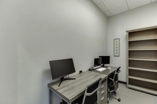 a view of workspace with cabinets