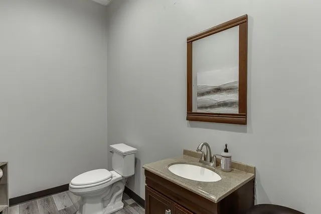 a view of a workspace with furniture and a projector