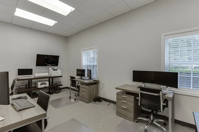 a kitchen with a refrigerator and a sink