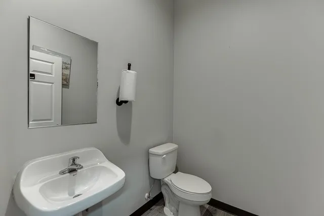 a kitchen with stainless steel appliances a stove a sink and a refrigerator