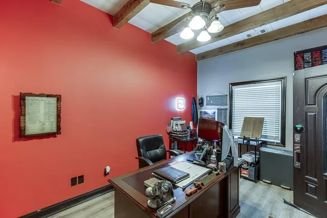 a view of kitchen with furniture and refrigerator