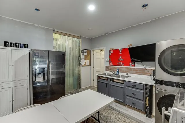 a view of a house with a yard and garage