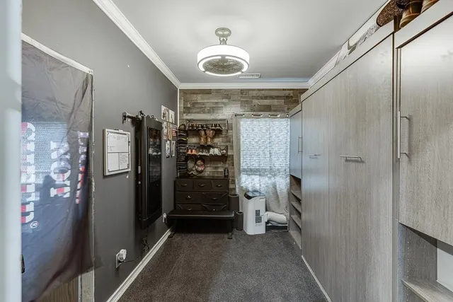 an aerial view of a house with swimming pool and garden