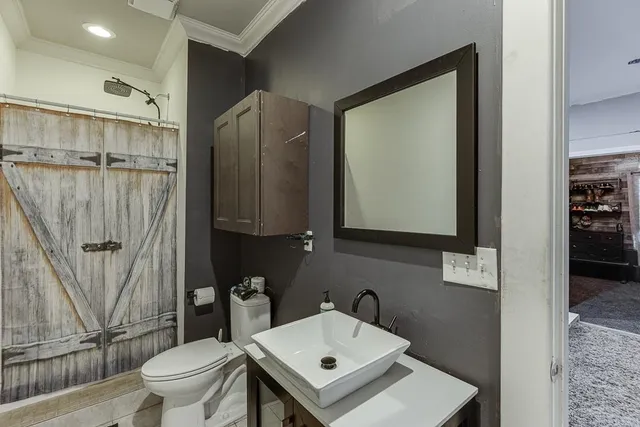 an aerial view of a house with a swimming pool