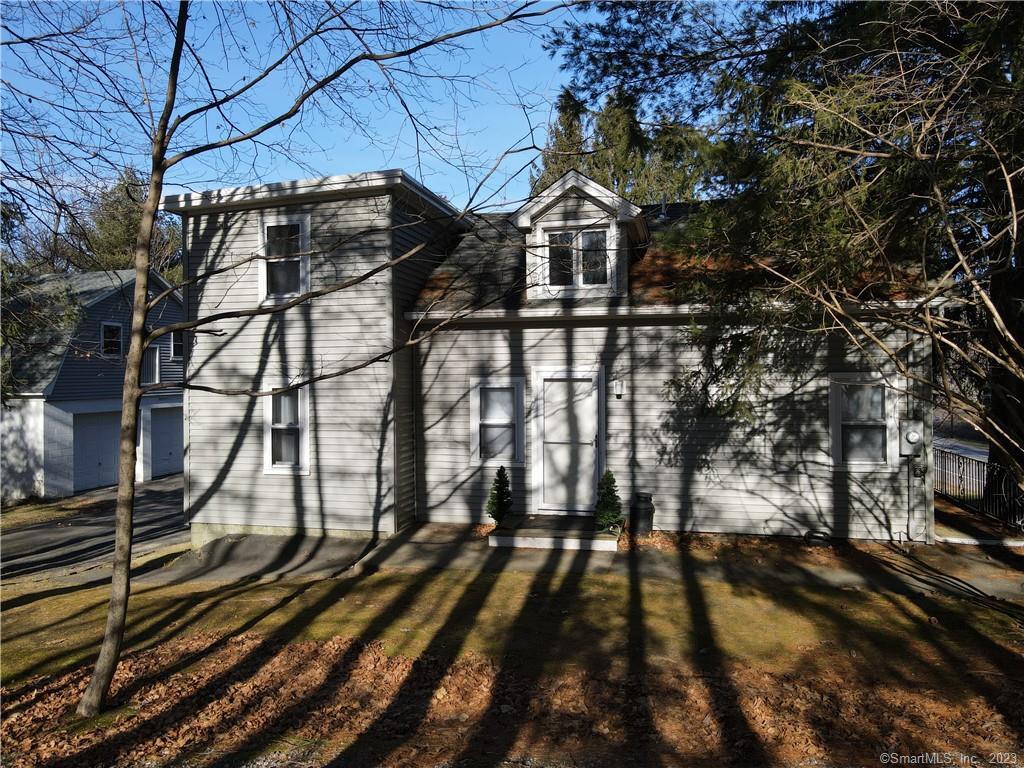 189 Torrington Road Litchfield, CT 06759 - Photo 1 of 1 a view of a yard with car parked on the road