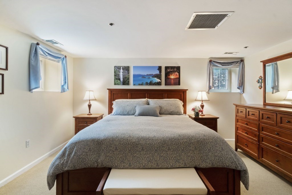 33 Main Street Boston, MA 02129 - Photo 12 of 17 a bedroom with a bed and dresser