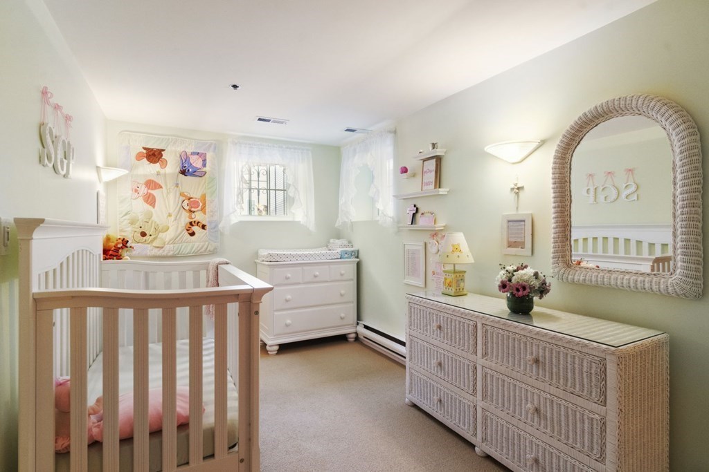 33 Main Street Boston, MA 02129 - Photo 15 of 17 a bedroom with furniture and window