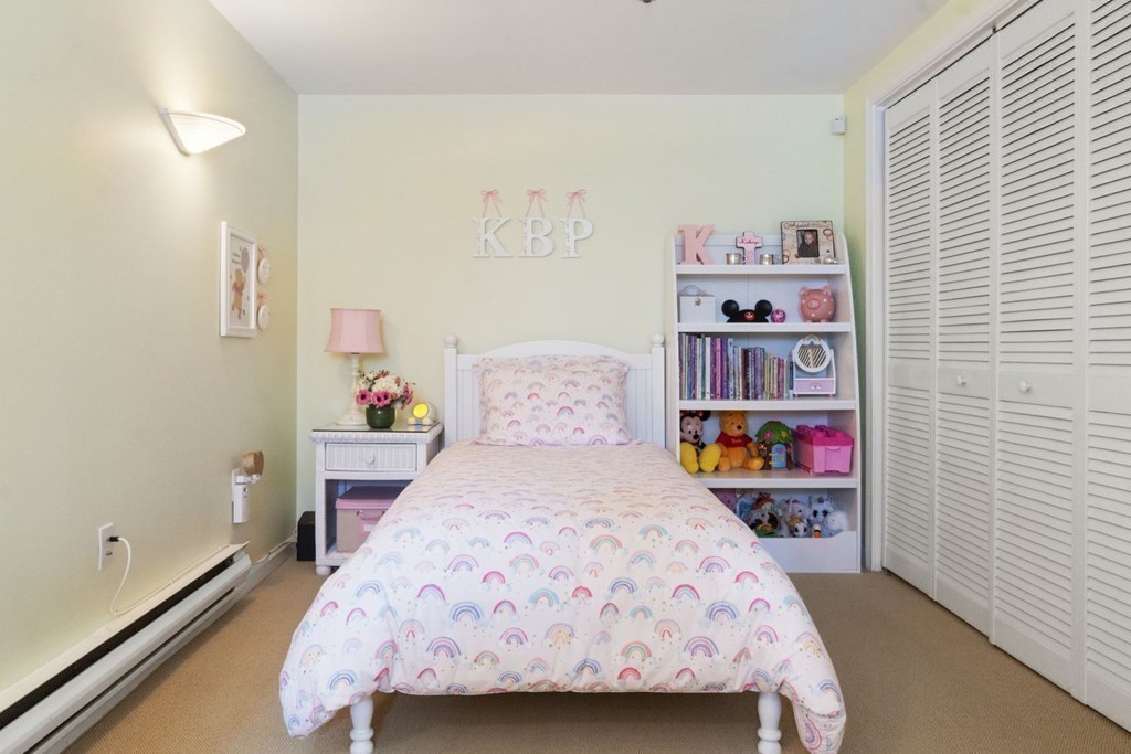 33 Main Street Boston, MA 02129 - Photo 16 of 17 a bedroom with a bed and a book shelf