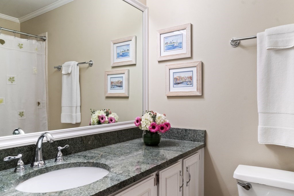 33 Main Street Boston, MA 02129 - Photo 10 of 17 a bathroom with a granite countertop sink and a mirror