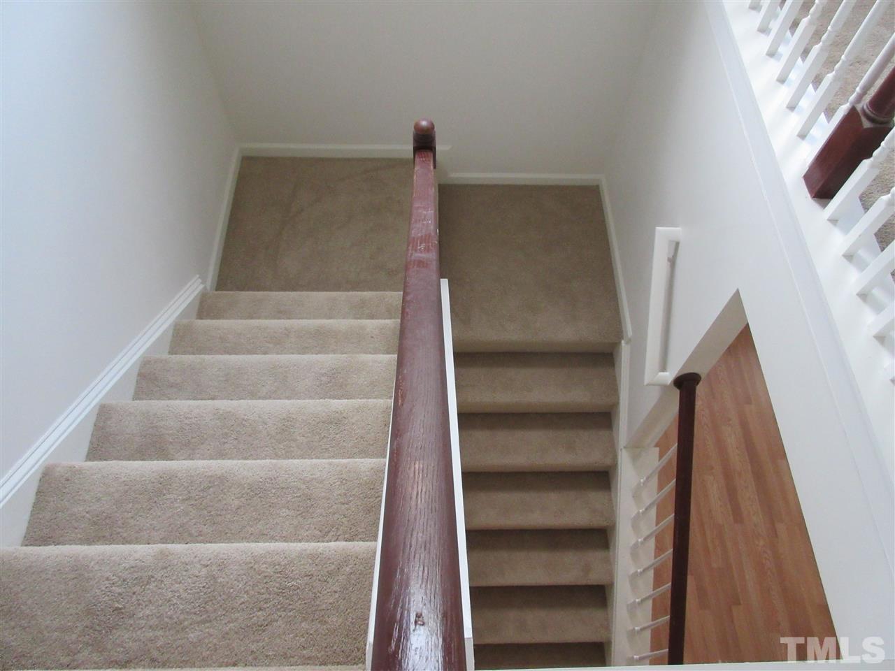 5253 Thornton Road Raleigh, NC 27616 - Photo 16 of 20 a view of walk in closet with empty racks