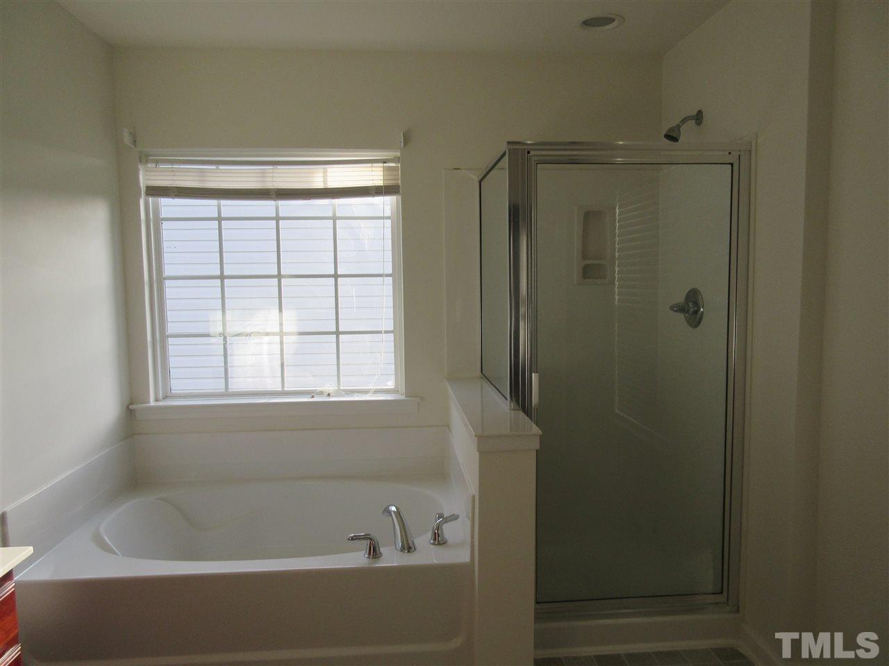 5253 Thornton Road Raleigh, NC 27616 - Photo 10 of 20 a bathroom with a bathtub