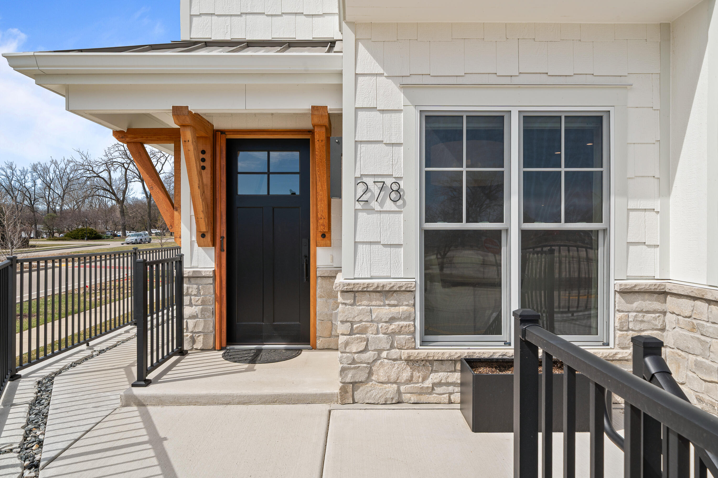 278 High Street, Unit 9 Fontana, WI 53125 - Photo 5 of 110 Patio that has a private walk to the back of the townhome. Unique to this Unit.