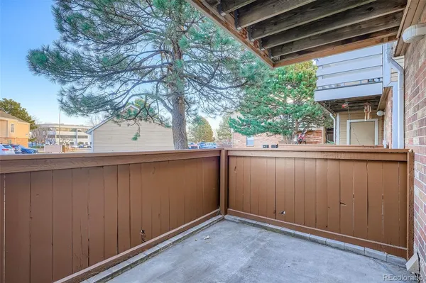 a view of a balcony with tree