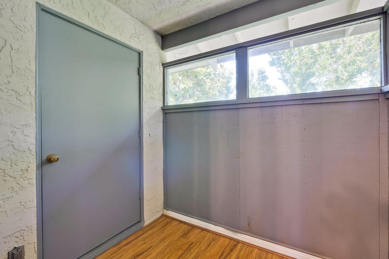 363 Kenbrook Circle San Jose, CA 95111 - Photo 2 of 21 a view of a small space with wooden floor and a window