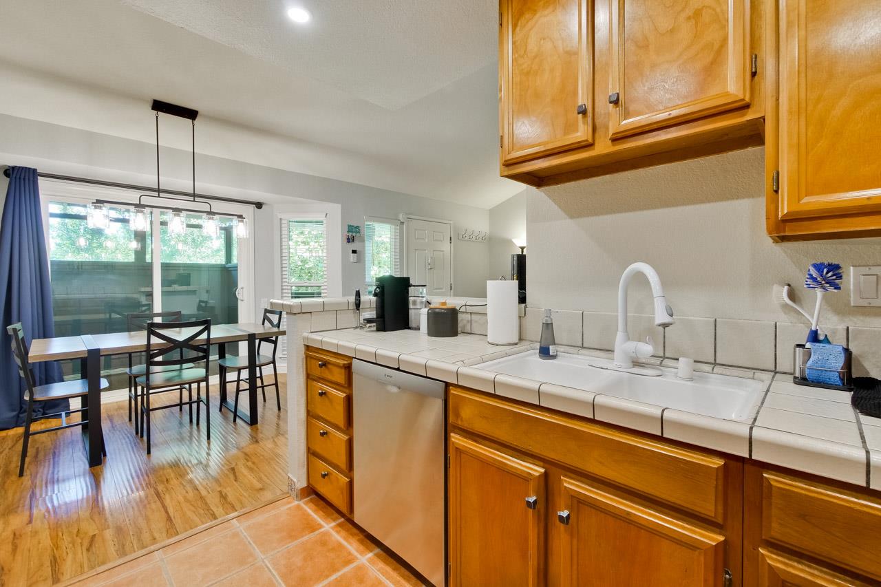 363 Kenbrook Circle San Jose, CA 95111 - Photo 6 of 21 a kitchen with lots of counter top space and dining table