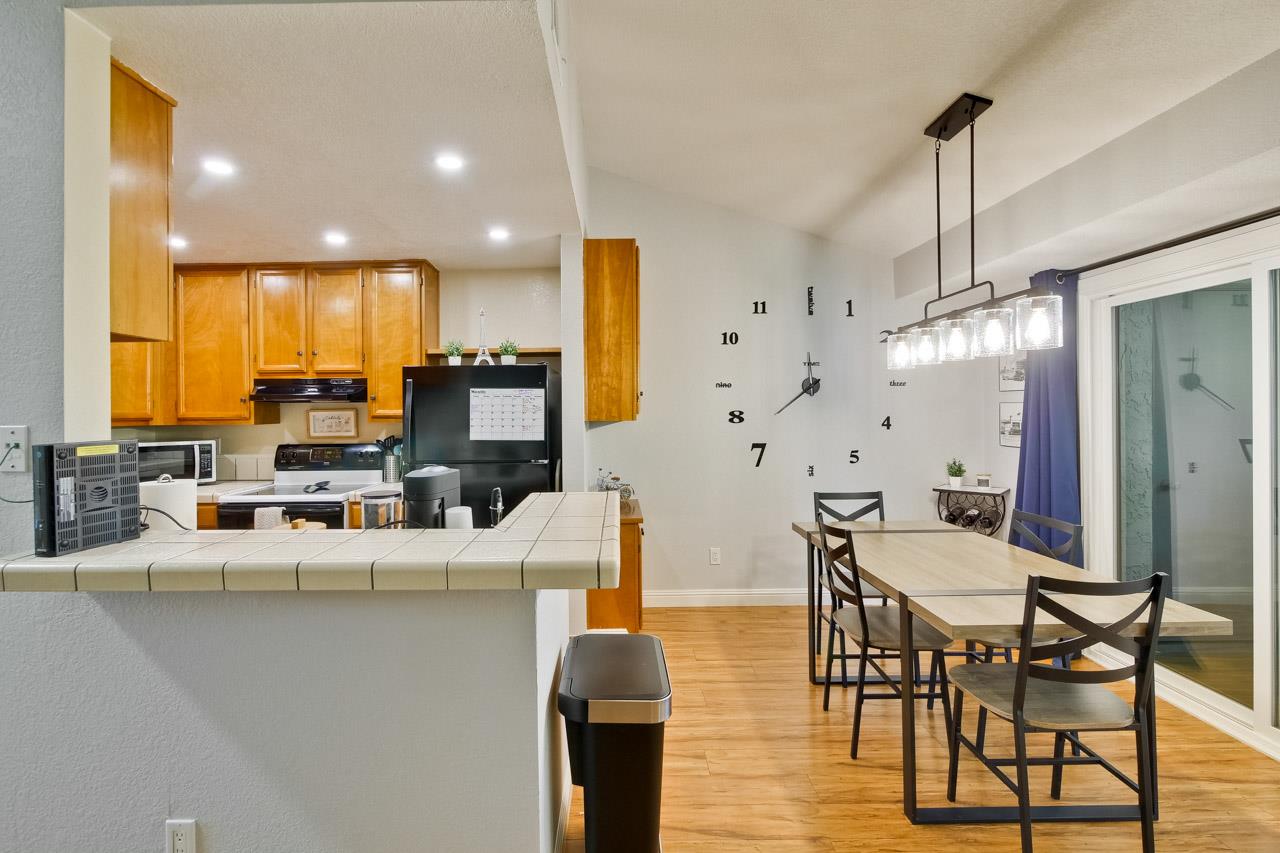 363 Kenbrook Circle San Jose, CA 95111 - Photo 8 of 21 a view of a dining room with furniture window and wooden floor