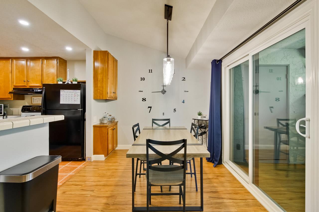 363 Kenbrook Circle San Jose, CA 95111 - Photo 9 of 21 a very nice looking dining room with a large window and stainless steel appliances
