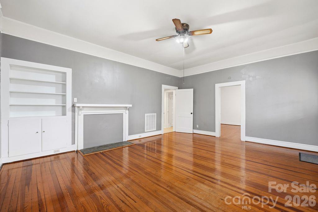 625 North Main Street Kannapolis, NC 28081 - Photo 13 of 26 wooden floor in an empty room with a window