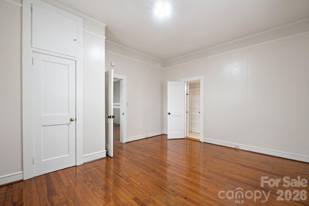 625 North Main Street Kannapolis, NC 28081 - Photo 15 of 26 a view of an empty room with wooden floor and closet