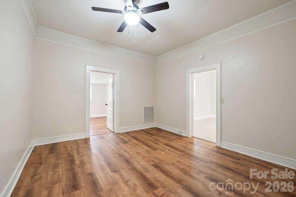 625 North Main Street Kannapolis, NC 28081 - Photo 18 of 26 a view of an empty room with wooden floor
