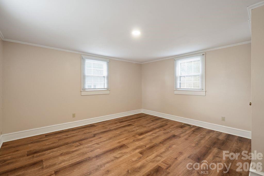 625 North Main Street Kannapolis, NC 28081 - Photo 19 of 26 a view of empty room with wooden floor and fan